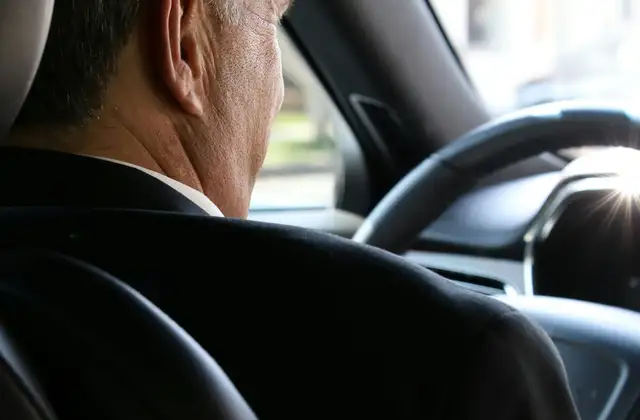 A private hire driver at the wheel